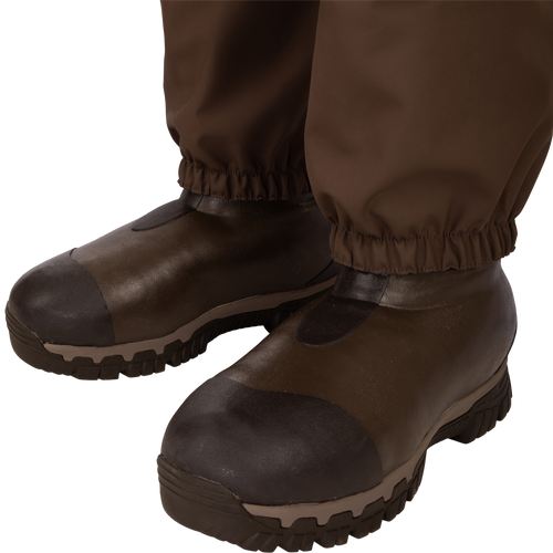 Uninsulated Guardian Elite HND Front Zip Waders - Habitat: A pair of brown boots with improved traction and cushioning, perfect for hunting in various terrains.