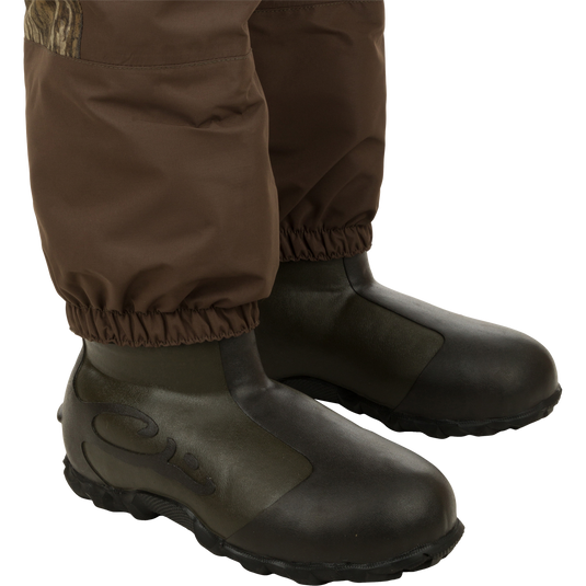 Brown boots - part of the Women’s Insulated Guardian Elite Vanguard Breathable Waders by Drake Waterfowl.