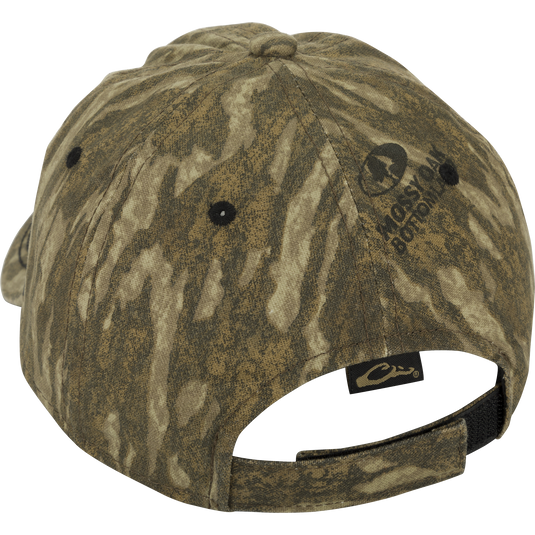 Camo Cotton Twill Hex Patch Cap - A close-up of a hat with a fabric label. Unstructured front panels and a hook and loop closure for a comfortable fit. Conquer the wild in this bold cap!