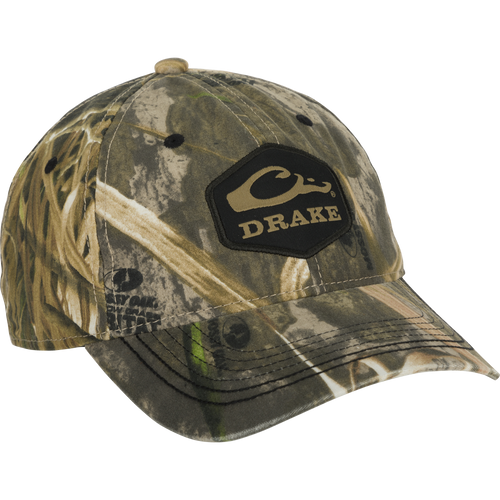 Camo Cotton Twill Hex Patch Cap - A low-profile baseball cap with a camouflage pattern and black logo. Made of breathable and durable cotton/polyester blend. Unstructured front panels and hook and loop closure for a comfortable fit. Perfect for outdoor adventures.