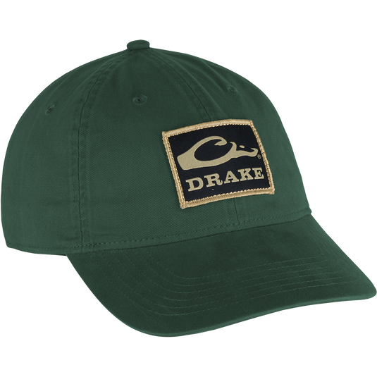 Cotton Twill Patch Cap - A low profile green hat with a logo on it. Crafted with 100% cotton twill, featuring a contoured bill and brass buckle back strap for a comfy fit. 