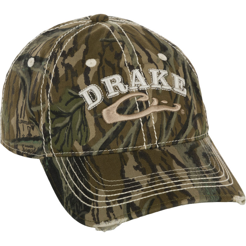 Distressed 6-Panel Ball Cap with raised Drake Logo embroidery, frayed visor, and contrast stitching. Non-structured, cotton twill panels and adjustable closure.
