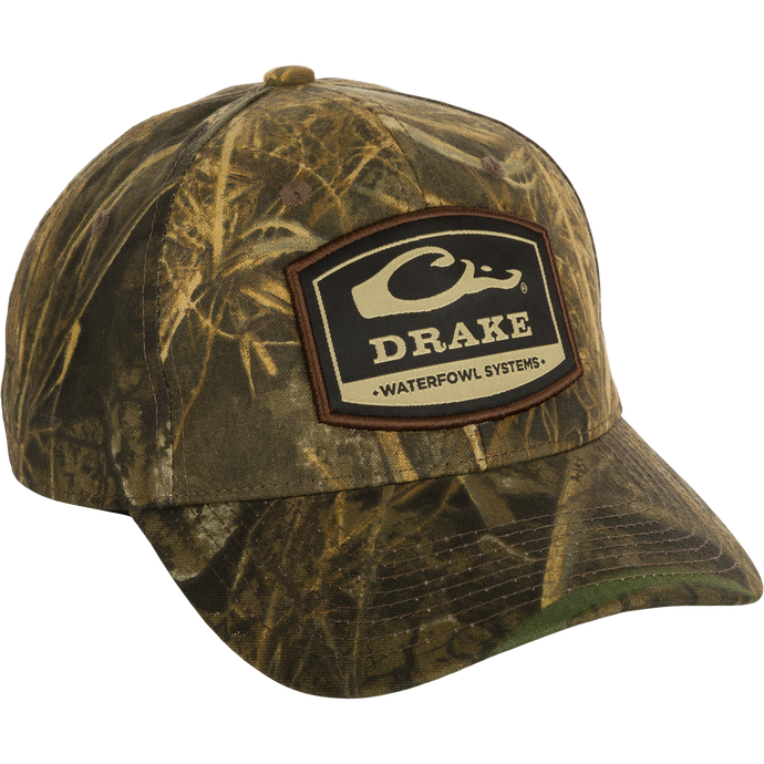 6-Panel Badge Cap - Realtree: A cotton blend cap with a patch on it. Features a secure fit with a rear snap closure. Perfect for outdoor enthusiasts.