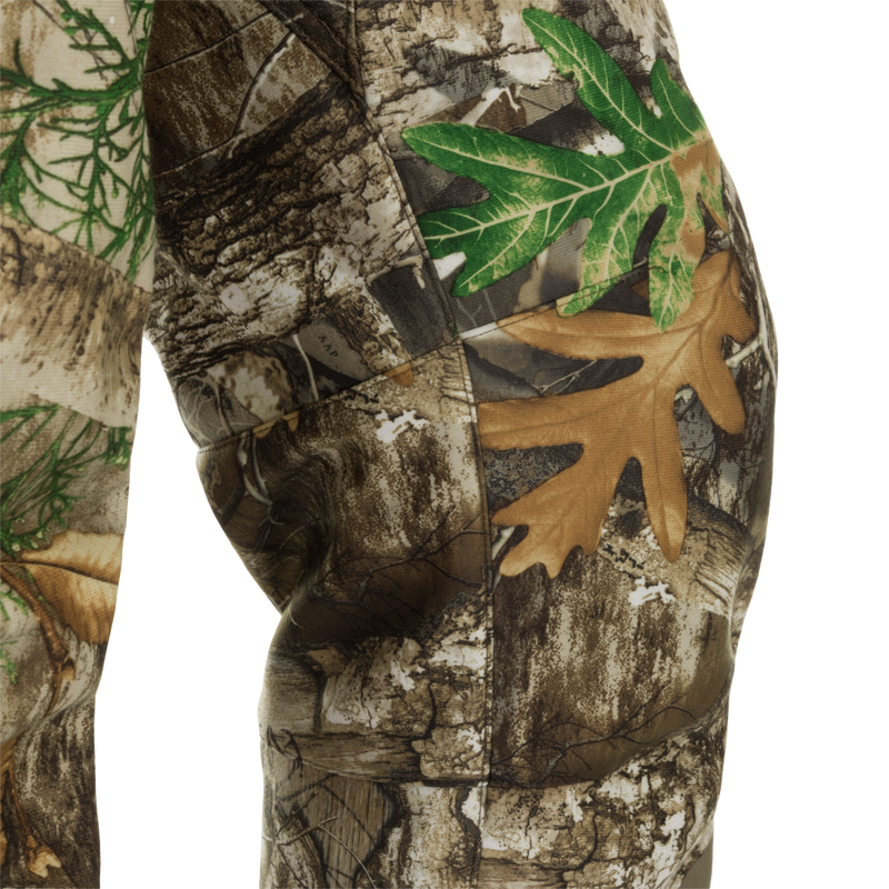 MST Microfleece Softshell Pants - Realtree: Close-up of camouflage pants with 4-way stretch fabric, microfleece lining, and side zips for easy movement. Agion Active XL® scent control technology included.