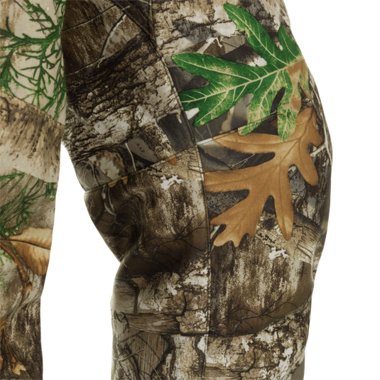 MST Microfleece Softshell Pants - Realtree: Close-up of camouflage pants with 4-way stretch fabric, microfleece lining, and side zips for easy movement. Agion Active XL® scent control technology included.
