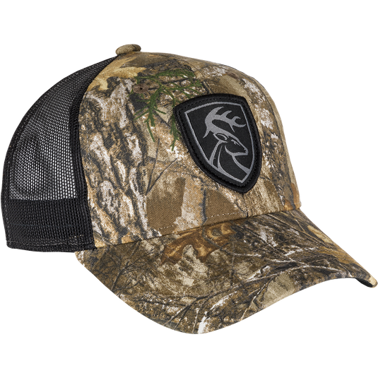 A black and brown camouflage hat with a logo patch of a deer head. Made with 100% cotton twill and breathable mesh on the back. Features a snap closure.