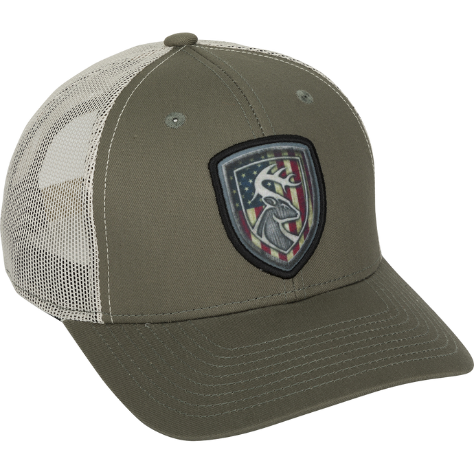 A cotton twill baseball cap with a patch featuring a deer logo. Mesh back for breathability. Adjustable snap closure.