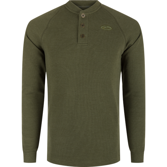 A durable Weston Lakes Waffle Henley in green, featuring raglan sleeves, metal logo buttons, ribbed collar, cuffs, and split tail hem. Ideal for hunting and outdoor activities.