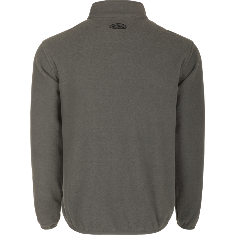 A lightweight grey Camp Fleece Pullover 2.0 with a logo, perfect for layering with Drake outerwear. Highly breathable and moisture-wicking, it's ideal for Spring or Fall outfits.