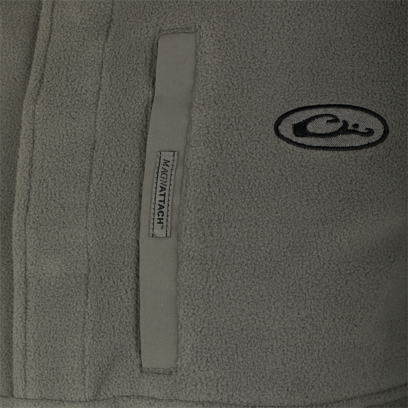 A close-up of the Camp Fleece Pullover 2.0 jacket's label and logo.