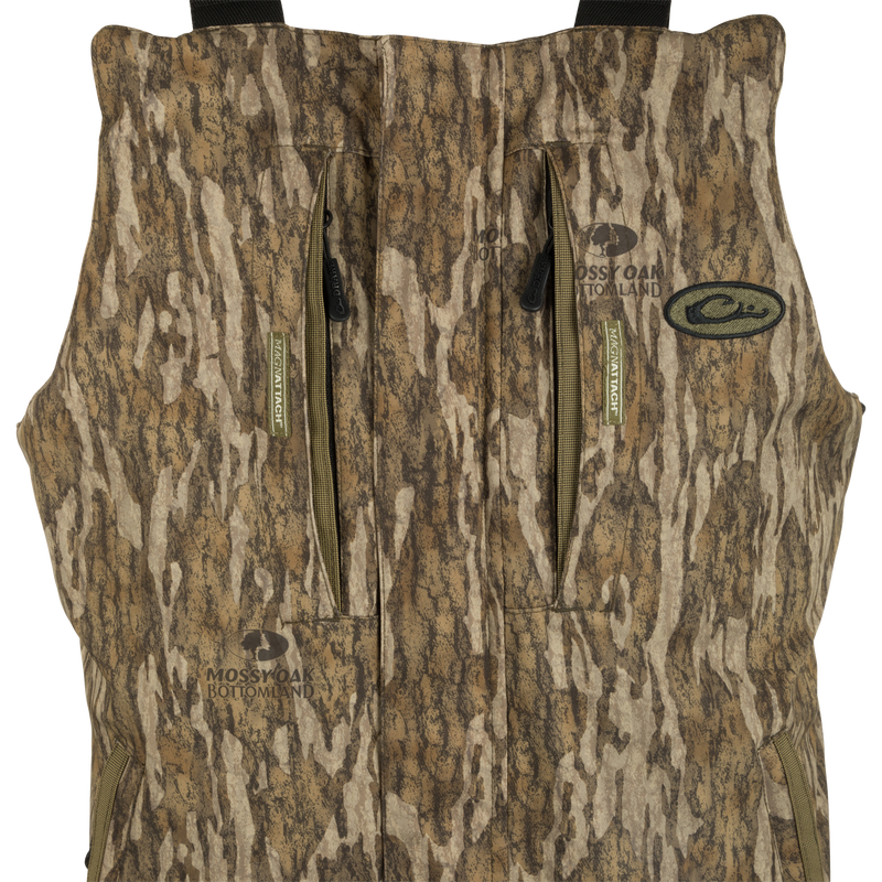 LST Reflex Insulated Bib: Waterproof, windproof vest with tree and camouflage patterns. Close-ups of fabric, logo, and sign. Rugged durability and performance for hunting and fishing.