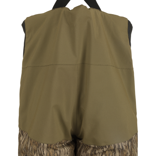 LST Reflex Insulated Bib: Close-up of waterproof, windproof fabric with reinforced knees. Rugged durability and comfort for outdoor activities.