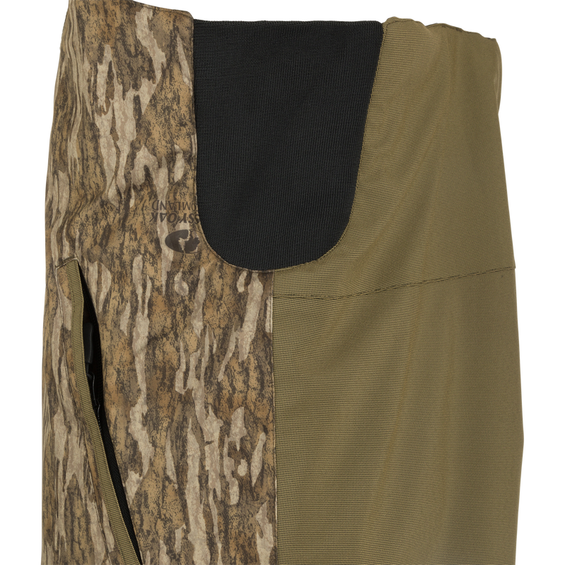 LST Reflex Insulated Bib: Close-up of knee-length zippers for easy boot access. Durable and comfortable hunting gear.