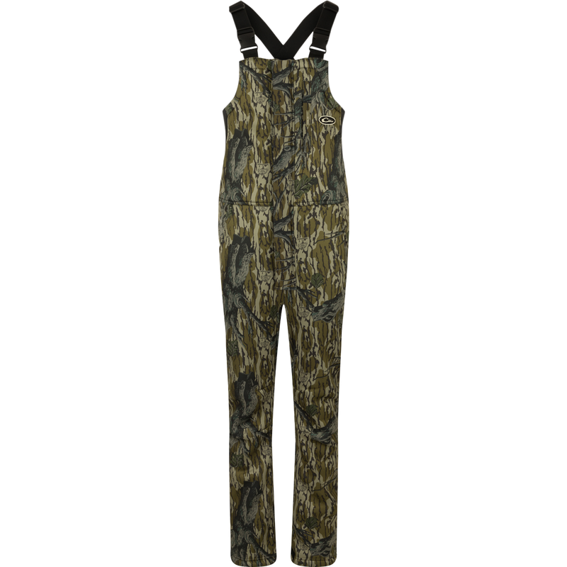 MST Ultimate Wader Bib: Camouflage overalls with straps, 4-way stretch, gusseted crotch, and articulated knees for easy movement. Sherpa-lined slash handwarmer pockets, Magnattach™ chest pocket, and zippered rear security pockets for storage. Ankle-fit for under waders.