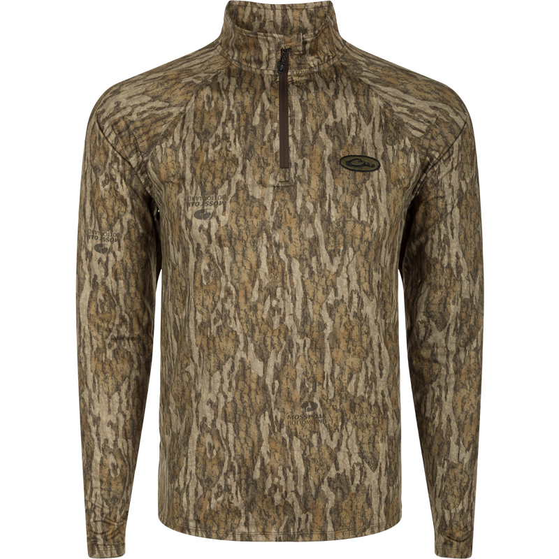A long sleeved shirt with a tree pattern, the EST Microlite 1/4 Zip Pullover, optimized for performance with 4-way stretch, thumb loops, and UPF 50+ treatment.