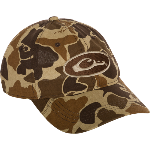 A lightweight Camo Cotton Cap with a logo, featuring full camo concealment, a six-panel construction, and a hook and loop closure.