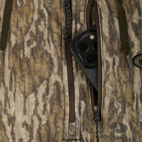 MST Breathelite 1/4-Zip Camo Hooded Base Layer: A phone in a pocket, close-up of zipper.