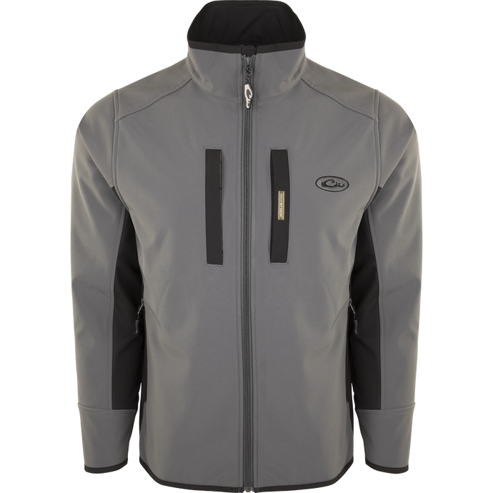 A Windproof Tech Jacket with a stylish two-tone design, perfect for cool Fall days and nights. Features include vertical and chest pockets with zipper closures, side stretch panels, and a drawstring waist. Made with a windproof laminate and check fleece backing.