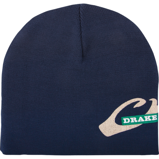 A blue beanie with a white logo, perfect for outdoor activities. Made of windproof knit poly-fleece with deep ear coverage. Drake Waterfowl's Solid Knit Stocking Cap.