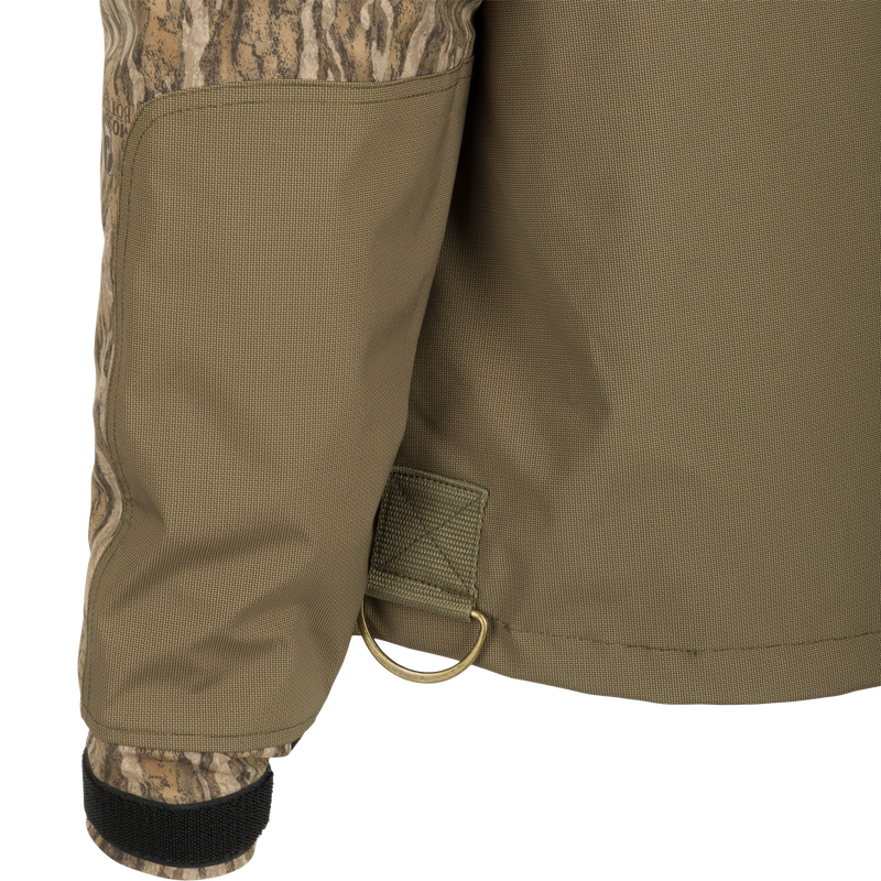 A close-up of the G3 Flex 3-in-1 Waterfowler's Jacket, showcasing its khaki fabric and functional design.