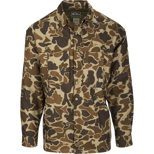 A lightweight, breathable camo shirt for early season hunting. Made of 100% polyester with UPF 50+ sun protection. Features include vented mesh back, Magnattach chest pocket, and quick-drying fabric. Perfect for dove, goose, or teal season. From Drake Waterfowl.