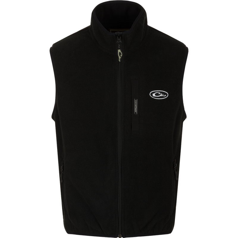 A black Youth Camp Fleece Vest with logo and zipper, featuring anti-pill treatment, moisture-wicking properties, Magnattach pocket, and zippered handwarmer pockets.