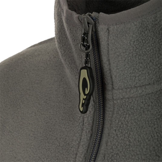 A close-up of the zipper on the Youth Camp Fleece Vest, showcasing its durability and functionality.