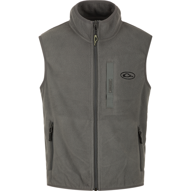 Youth Camp Fleece Vest with zipper and pockets, made from durable 100% Polyester and 210g Micro Fleece. Anti-pill treatment, moisture-wicking, and Magnattach pocket for secure storage.