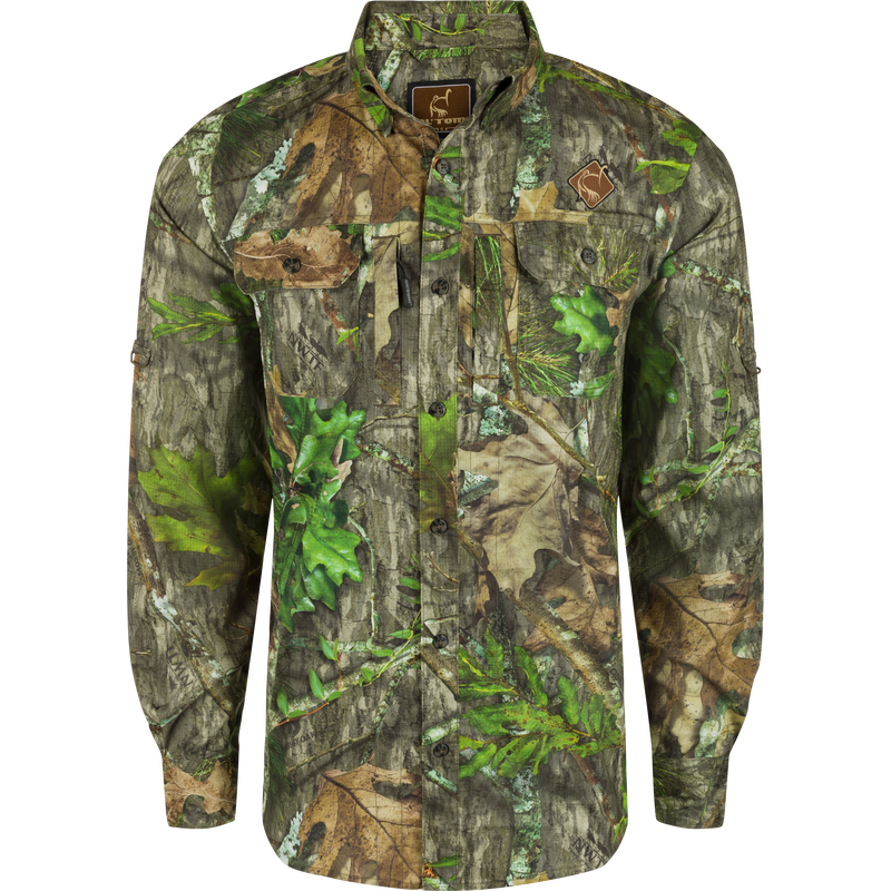 Men's Camo Wingshooter Trey Shirt L/S with hidden pockets, UPF30, and moisture-wicking fabric for hunting and outdoor activities by Drake Waterfowl.