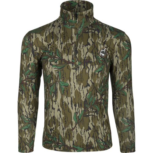 Ol' Tom Performance 1/4 Zip: A camouflage jacket with logo, perfect for hot-weather turkey hunting. Moisture-wicking, ultralight fabric with quick-drying and fade-resistant properties. Semi-structured collar for concealment and sun protection.