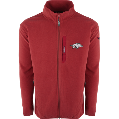 A red jacket with a pig on it, featuring Arkansas logo embroidery on right chest. Windproof, water resistant ultra-warm fleece. Stand-up collar, Magnattach™ left chest pocket, and lower handwarmer pockets. Arkansas Full Zip Camp Fleece.