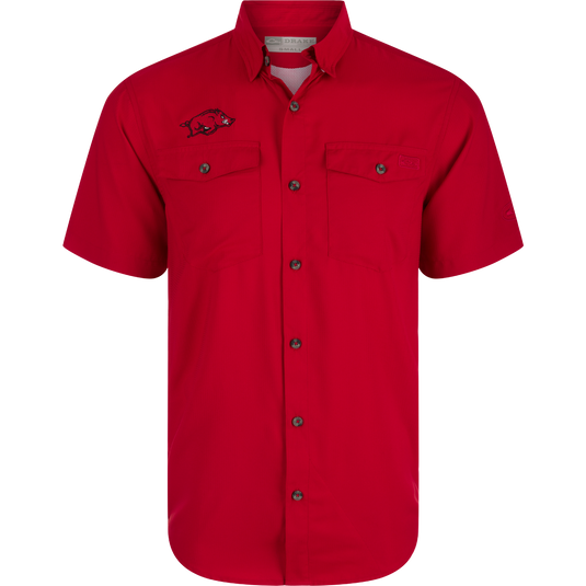 Arkansas Frat Dobby Solid Short Sleeve Shirt: Red shirt with logo and pig design, hidden button-down collar, vented cape back, and two chest pockets. Lightweight, moisture-wicking fabric with UPF30 sun protection.
