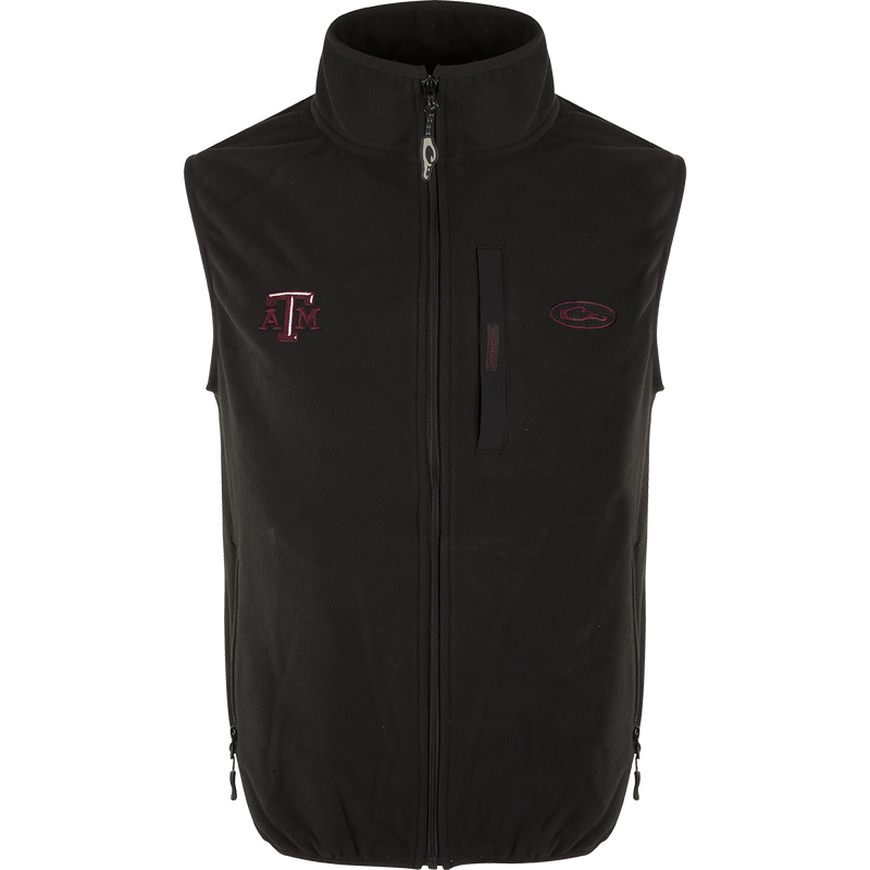 Texas A&M Camp Fleece Vest with logo embroidery on right chest. Windproof, water resistant, ultra-warm fleece. Stand-up collar, Magnattach™ pocket, hand warmer pockets.