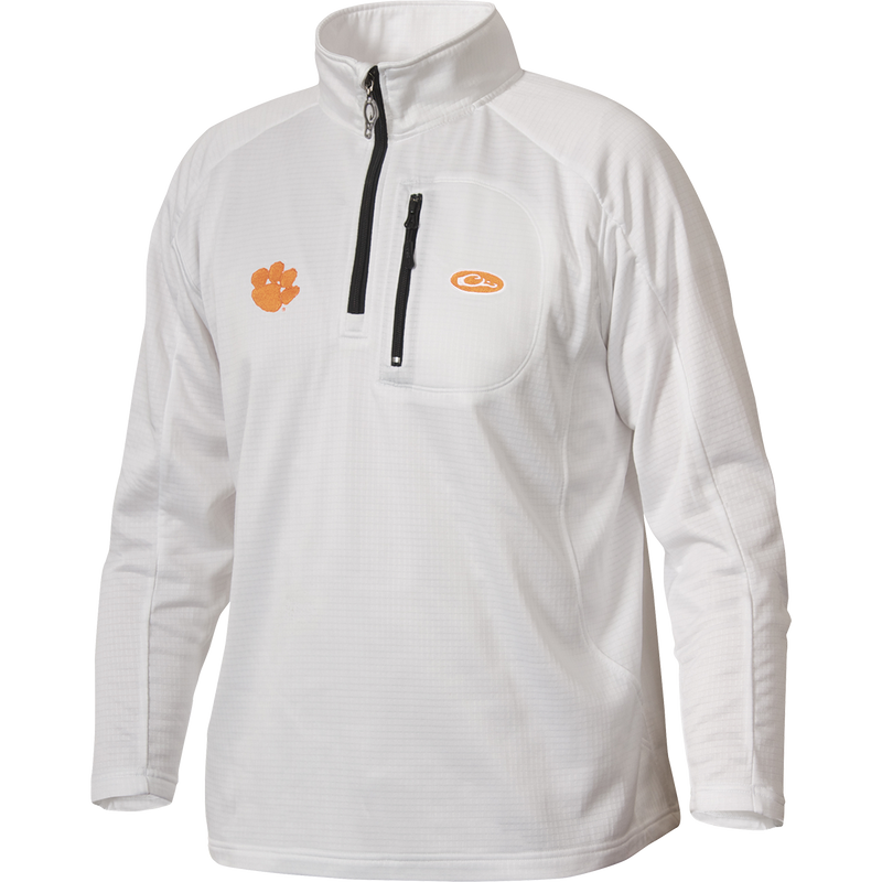 A white Clemson Breathelite™ 1/4 Zip jacket with a zipper on the front chest pocket, featuring the Clemson University Tiger Paw logo embroidery on the right chest. Made of 100% polyester with 4-way stretch and square check fleece backing. Ideal for active outdoorsmen in cool weather.