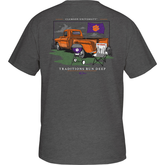Clemson Drake Tailgate T-Shirt with orange truck and purple chair design. Lightweight and comfortable 60% cotton/40% polyester blend. School logo pocket on the front. Perfect for tailgate parties and watch parties!