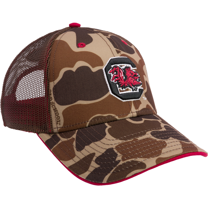 South Carolina Old School Cap: Camouflage hat with red and black logo, mesh back panels, structured crown, X-Peak visor, 3D embroidered college logo, snap-back closure. From Drake Waterfowl's Collegiate Series.