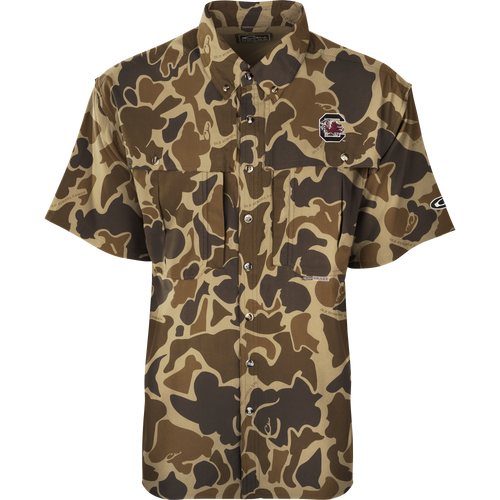 South Carolina S/S Flyweight Wingshooter: A camouflage shirt with a gamecock logo, perfect for warm-weather outdoor activities. Made of ultra-lightweight polyester, it dries quickly and wicks moisture away. Features include UPF 50+ sun protection, vented back, chest pockets, and a vertical zipper pocket.