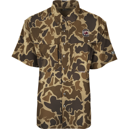 South Carolina S/S Flyweight Wingshooter: A camouflage shirt with a gamecock logo, perfect for warm-weather outdoor activities. Made of ultra-lightweight polyester, it dries quickly and wicks moisture away. Features include UPF 50+ sun protection, vented back, chest pockets, and a vertical zipper pocket.