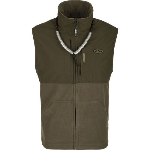 MST Eqwader Vest: A versatile green and grey vest with a silver necklace. Features include waterproof protection, fleece-lined upper body, and multiple pockets for storage. Ideal for hunting and outdoor activities.
