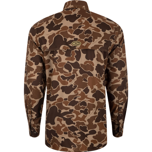A close-up of the Drake 8-Shot Flyweight L/S Shirt with a camouflage pattern and logo on the back. Features a hidden button-down collar, vented cape back, and adjustable roll-up sleeves.