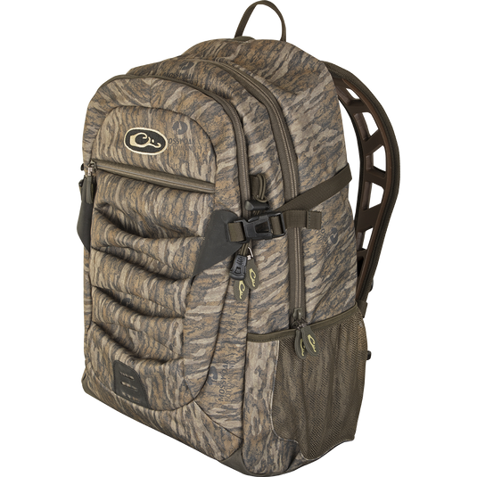 A rugged Camo Daypack by Drake Waterfowl, ideal for versatile use from classrooms to the field. Features ample storage, hydration pockets, and durable HD2™ material. Dimensions: 18.5 x 11.5 x 8.5.