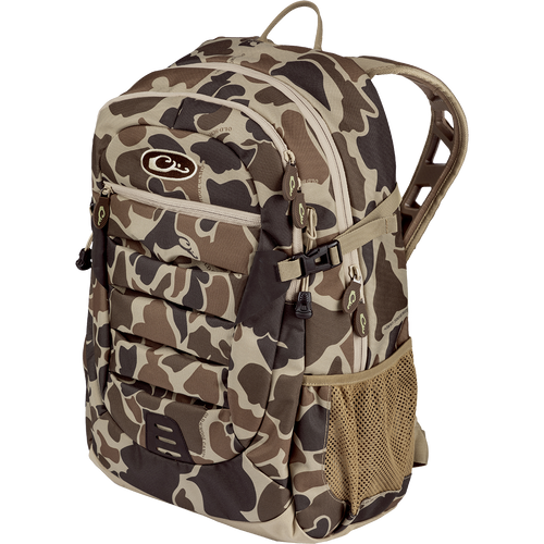 A rugged Camo Daypack by Drake Waterfowl, ideal for versatile use from classroom to field. Features include large storage, hydration pockets, EVA shoulder straps, and more. Dimensions: 18.5 x 11.5 x 8.5.