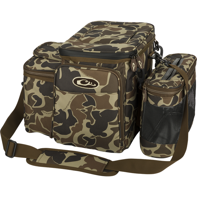 Wingshooter's Shell Boss: A camouflage bag with straps, perfect for carrying all your hunting essentials and hydration. Features a 12-Can/Bottle cooler compartment and quick-access flap for easy shell retrieval. Includes a removable mesh game bag for carrying your birds. Made with rugged, PVC-Backed, 100% Polyester HD2™ material. Dimensions: 12