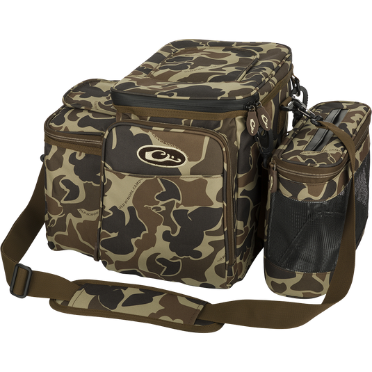 Wingshooter's Shell Boss: A camouflage bag with straps, perfect for carrying all your hunting essentials and hydration. Features a 12-Can/Bottle cooler compartment and quick-access flap for easy shell retrieval. Includes a removable mesh game bag for carrying your birds. Made with rugged, PVC-Backed, 100% Polyester HD2™ material. Dimensions: 12"H x 17"W x 13"D.
