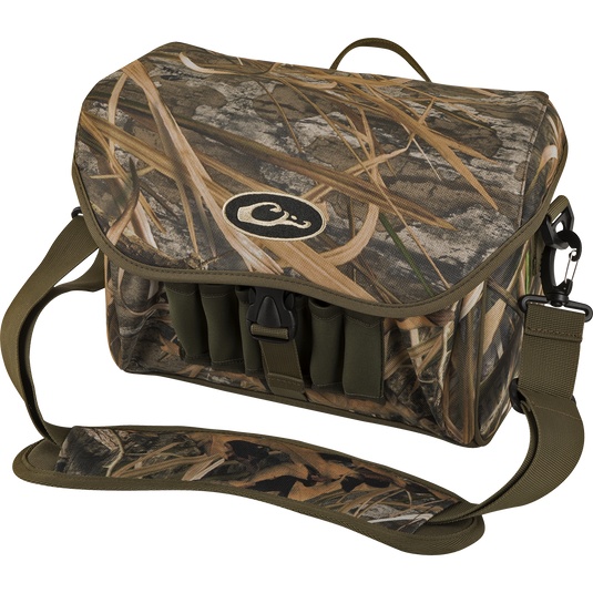 Refuge Blind Bag by Drake Waterfowl: Camouflage bag with adjustable strap, logo detail, and durable hardware. Ideal for daily waterfowl hunting with improved zipper, outer pocket, and neoprene shell loops.
