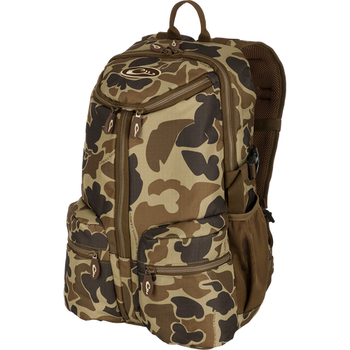 A compact and functional Vertical Zip Daypack, perfect for hunting and everyday use. Features include padded shoulder straps, large interior storage, external carry straps, and more. Ideal for storing essential items with ease.