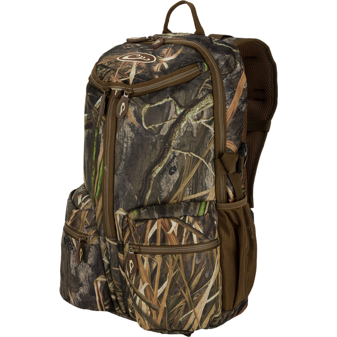A compact, functional Vertical Zip Daypack with optimal storage and accessibility. Perfect for hunting, travel, or everyday use. Features padded shoulder straps, large interior storage, external carry straps, and more. Made with rugged HD2™ material and Fowl-Proof™ YKK zippers.