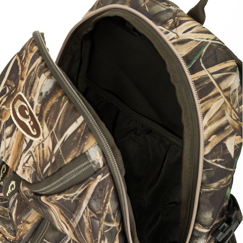 A compact and functional Vertical Zip Daypack, perfect for casual or hunting use. Features include large interior storage, external carry straps, and adjustable shoulder and waist straps. Made with rugged HD2™ material and Fowl-Proof™ YKK zippers. Dimensions: 18.5