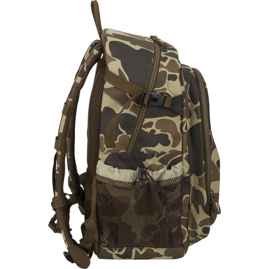 A rugged, PVC-backed Hardshell Every Day Pack with padded shoulder strap, outer zippered pouch, mesh side pockets, interior storage, sunglasses pouch, and more. Ideal for day trips, travel, or everyday use.