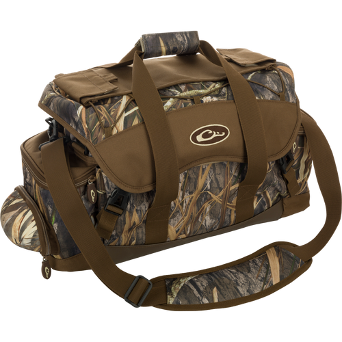 A large blind bag with camouflage pattern and multiple pockets for organizing gear. Waterproof construction with durable materials for long-lasting use. Adjustable straps for comfortable carrying. Dimensions: 18